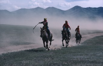 MONGOLIA, Sport, Boy jockeys and horses taking part in National Day 50km horse race.