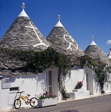 ITALY, Puglia, Alberobello, Traditional Trulli houses.