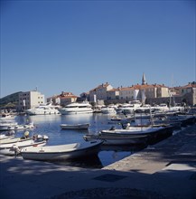 MONTENEGRO, Budva, View across the harbour toward the old town.