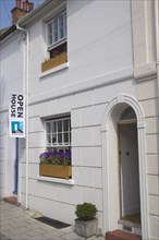 ENGLAND, East Sussex, Brighton, "Open house for Brighton fesitval, with colourful flowers in window