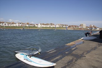 ENGLAND, East Sussex, Brighton, Hove lagoon with windsurfers