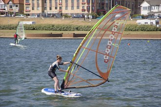 ENGLAND, East Sussex, Brighton, Hove lagoon with windsurfers