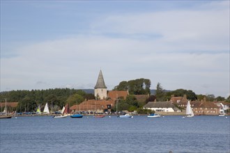 ENGLAND, West Sussex, Bosham, View across water toward Old Bosham with the church spire visible