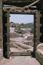 QATAR, Architecture, Old village seen through a carved doorway