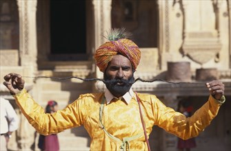 INDIA, Rajasthan, Jaisalmer, Portrait of man displaying the World’s Longest Moustache and wearing