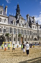 FRANCE, Ile de France, Paris, The Paris Plage urban beach. Young people playing beach football in