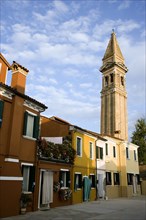 ITALY, Veneto, Venice, The leaning bell tower of the church on the lagoon island of Burano set