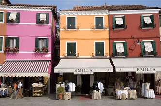ITALY, Veneto, Venice, Brightly coloured houses above lace shops on the lagoon island of Burano the