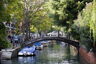 ITALY, Veneto, Venice, A bridge across a canal on the Lido