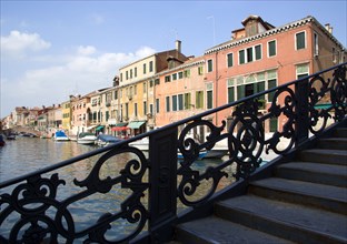 ITALY, Veneto, Venice, A wrought iron bridge heading north out of the Ghetto Novo onto Fondamenta
