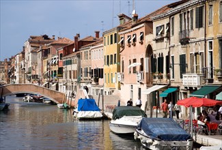 ITALY, Veneto, Venice, Fondamenta Degli Ormesini in Cannaregio district with boats moored along the