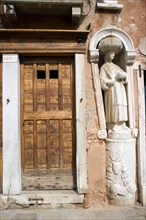ITALY, Veneto, Venice, A stone figure of a Moor beside Tintoretto's house on Fondamenta dei Mori in