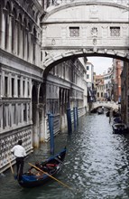 ITALY, Veneto, Venice, Gondola with tourists passes along the Rio Del Palazzo under the Bridge of