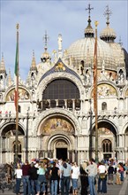 ITALY, Veneto, Venice, Tourists in Piazza San Marco in front of St Marks Basilica