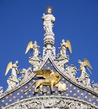 ITALY, Veneto, Venice, "The 15th Century statues of St Mark and Angels over the central arch of St