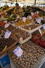 ITALY, Veneto, Venice, Fruit and vegetable stall in the Rialto market with vendor