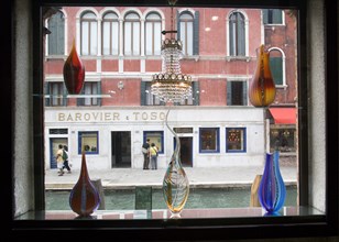 ITALY, Veneto, Venice, Tourists walking along the Fondamenta dei Vetrai looking in the windows of a