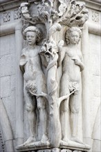 ITALY, Veneto, Venice, A stone carving of Adam and Eve with the Serpent in the tree on the corner