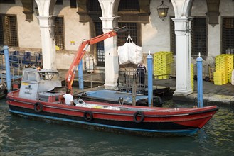 ITALY, Veneto, Venice, A postal service barge collecting mail from the main post office on the