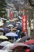 JAPAN, Honshu, Kyoto, Rainy day in crowded Eastern Kyoto lane near Ginkaku-ji Temple