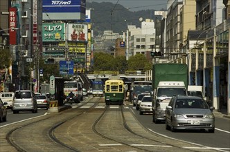 JAPAN, Kyushu, Nagasaki, Kanko dori - cars tram and tramlines in main downtown shopping street