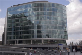 ENGLAND, London, Glass fronted offices on the southbank on the Queens walk next to the GLA City