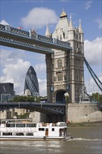 ENGLAND, London, Detail of  Tower Bridge on the River Thames with the Gherkin tower seen through