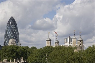 ENGLAND, London, View of the Skyline showing the Tower of London and the Gherkin glass building.