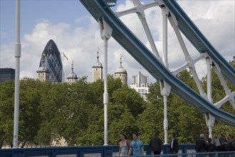 ENGLAND, London, The Tower of London and the Gherkin seen through a detail of  Tower bridge.