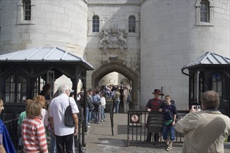 ENGLAND, London, "Tourists entering the Tower of London, yoing boy having his picture teken with a