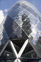 ENGLAND, London, The Swiss Re building 30 St Mary Axe alternatively known as the Gherkin seen from