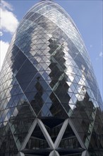 ENGLAND, London, The Swiss Re building 30 St Mary Axe alternatively known as the Gherkin seen from