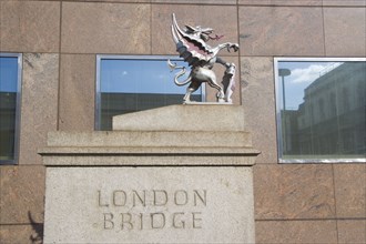 ENGLAND, London, London Bridge detail with statue of Griffin on the Southwark side. Griffins mark