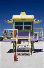 USA, Florida, Miami, South Beach. Colourful Lifeguard station on sandy beach