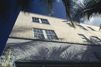 USA, Florida, Miami , South Beach. Detail of Art Deco building. Angled view with palm trees