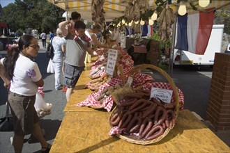 ENGLAND, West Sussex, Shoreham-by-Sea, French Market. Selection of sausages and cured meat on