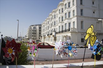 ENGLAND, West Sussex, Worthing, Display of colourful wind veins outside a seaside shop