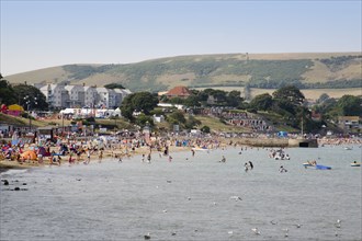 ENGLAND, Dorset, Swanage Bay, View across the sea towards the shoreline of sandy beach with