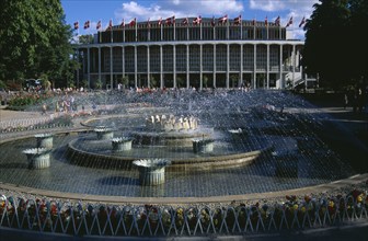 DENMARK , Zealand, Copenhagen, Tivoli Gardens. Concert Hall and fountains.