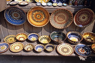 BULGARIA, Veilko Tarnovo, Traditional Bulgarian pottery on display outside gift and craft shop.