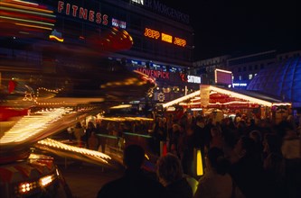 GERMANY, Berlin, Breitscheidplatz. Christmas Market. Funfair and stalls colourfully Illuminated at
