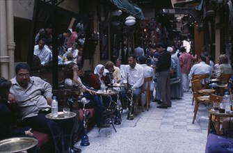EGYPT, Cairo Area, Cairo, Fishawi’s coffee house in the Khan el-Khalili bazaar with men and women