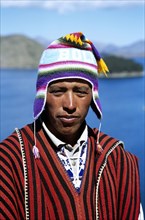 BOLIVIA, Lake Titicaca, "Sun Island. Man wearing hat, Inti Wata Cultural Complex."