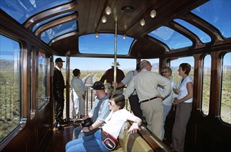 PERU, Transport, Passengers relaxing in observation carriage of Puno to Cusco Perurail train