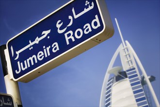 UAE, Dubai, Jumeira Road sign with the Burj al-Arab behind.