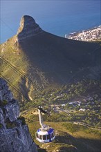 SOUTH AFRICA, Western Cape, Cape Town, Cable car on Table Mountain with the Lion's Head in the