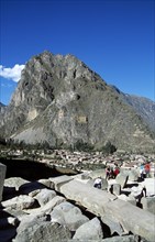 PERU, Near Cusco, Ollantaytambo, "Pinkuylluna Mountain and tourists, Sacred Valley of the Incas."