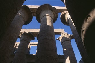EGYPT, Nile Valley, Karnak, Temple Of Amun. Coloumns in the Great Hypostyle Hall. Angled view