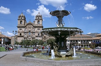 PERU, Cusco, "Iglesia La Compania de Jesus, and ornate fountain, Plaza de Armas."