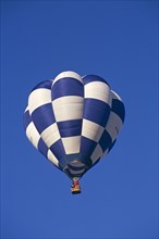 ENGLAND, Bristol, Blue and white checked hot air balloon.